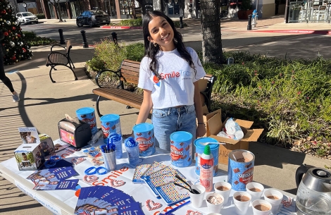 Girl tabling for a Smile Train fundraiser