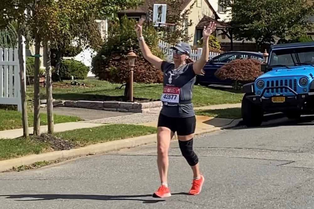 Lucy celebrates a virtual marathon finish