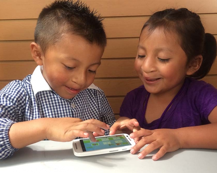two children playing Smile Train speech therapy app