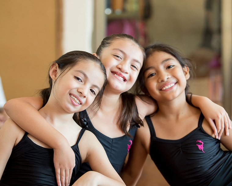 Aquetzaly smiling with her friends at ballet after her cleft surgery